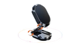 A black magnetic car phone mount with an orange accent clip, shown open on a white background with a faint circular graphic underneath.